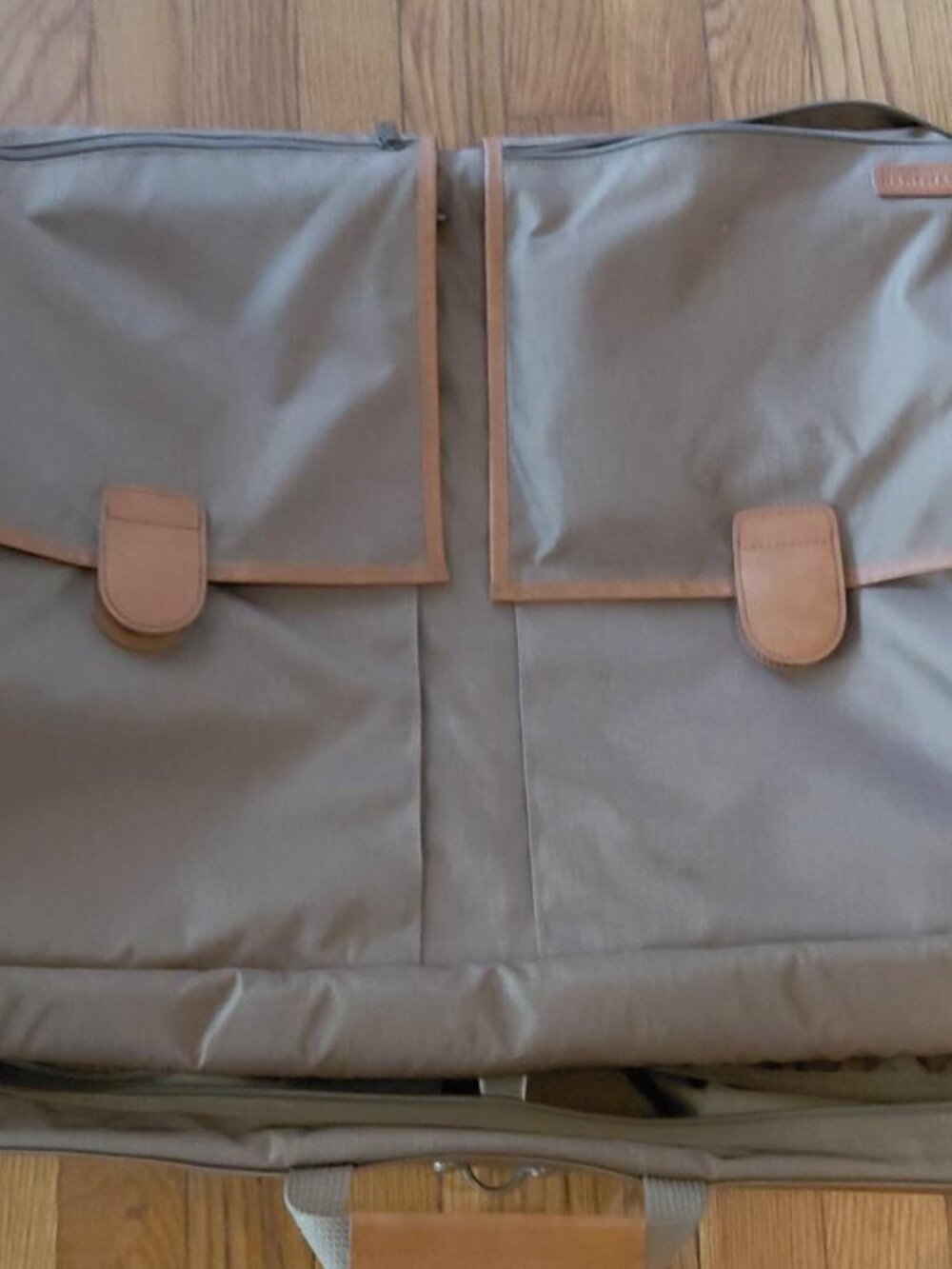 Features 2 deep front pockets with exterior/ interior zipper compartments galore